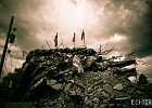 Standing tall  An American, Canadian, and other flags rising out of the rubble left after the quake of 2010. : Haiti, Posted