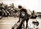 Fisherman  A fisherman puls in his net on the Buriganga river in Dhaka, Bangladesh : Bangladesh, Old