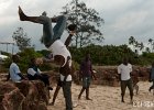 Up in the Air I  A Tanzanian boy does a flip off the rocks on the beach in Dar es Salaam : Dar es Salaam, Tanzania