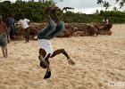 Up in the Air III  A Tanzanian boy does a flip off the rocks on the beach in Dar es Salaam : Dar es Salaam, Tanzania